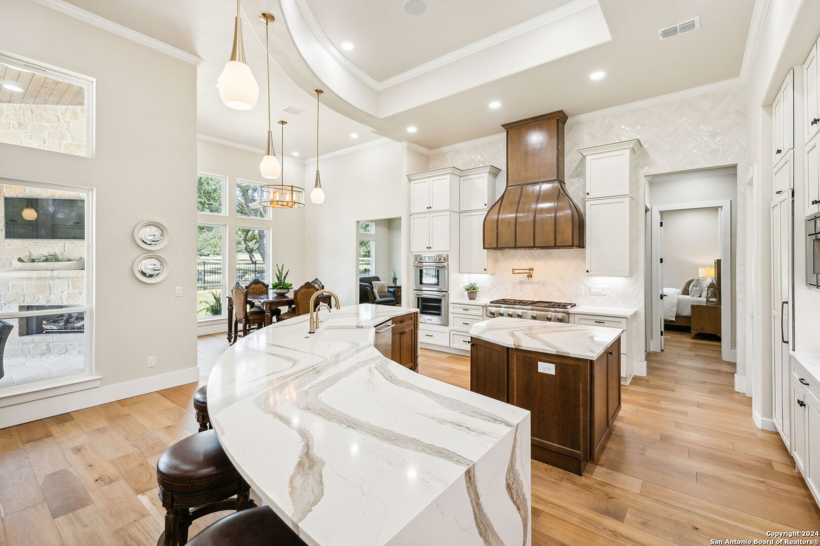 a large kitchen with cabinets a sink and a stove