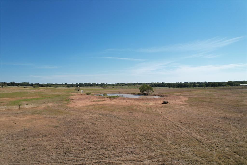 a view of lake with green space