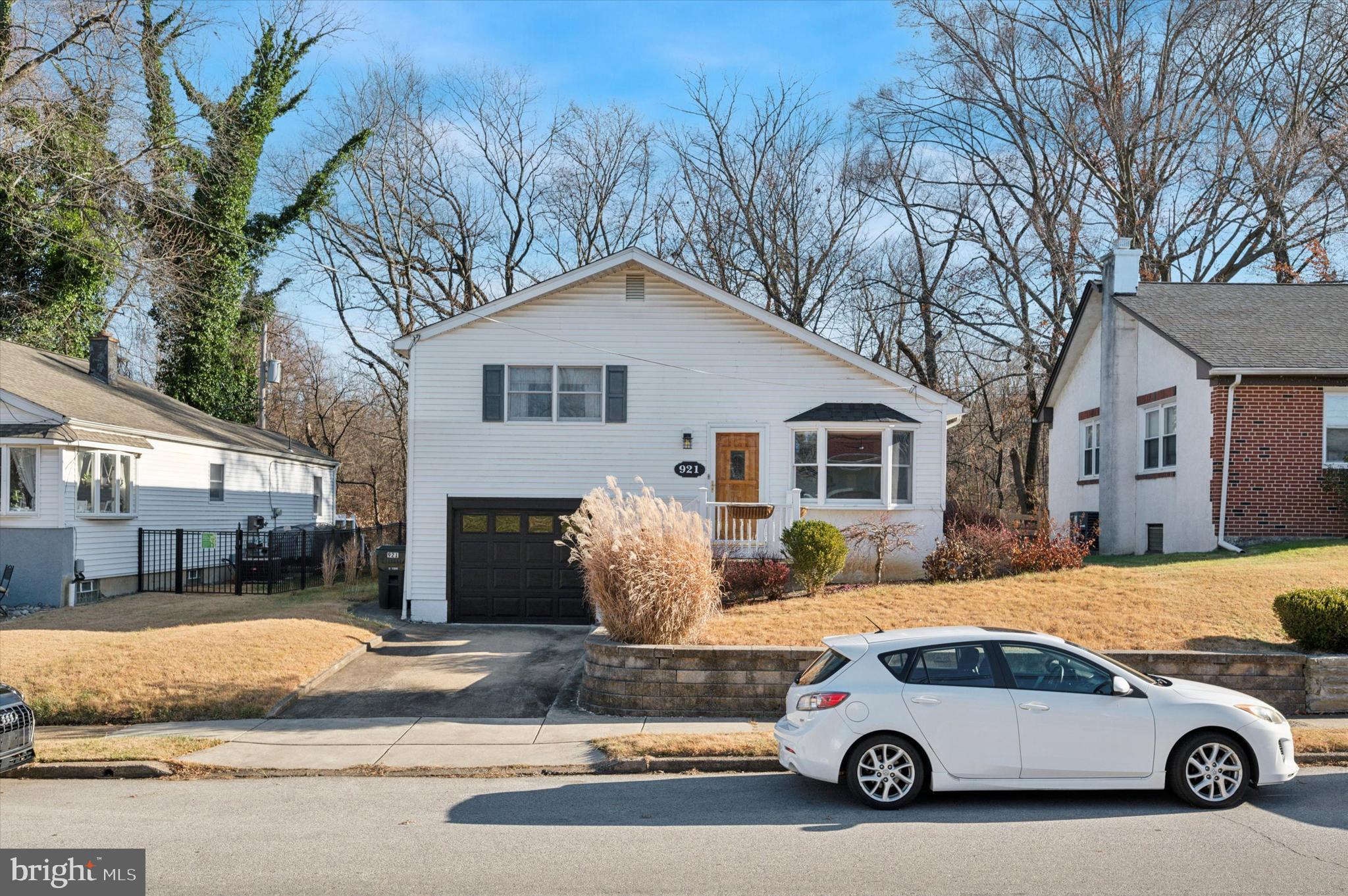 a car parked in front of a house