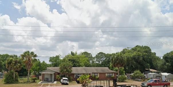 an aerial view of a houses with yard