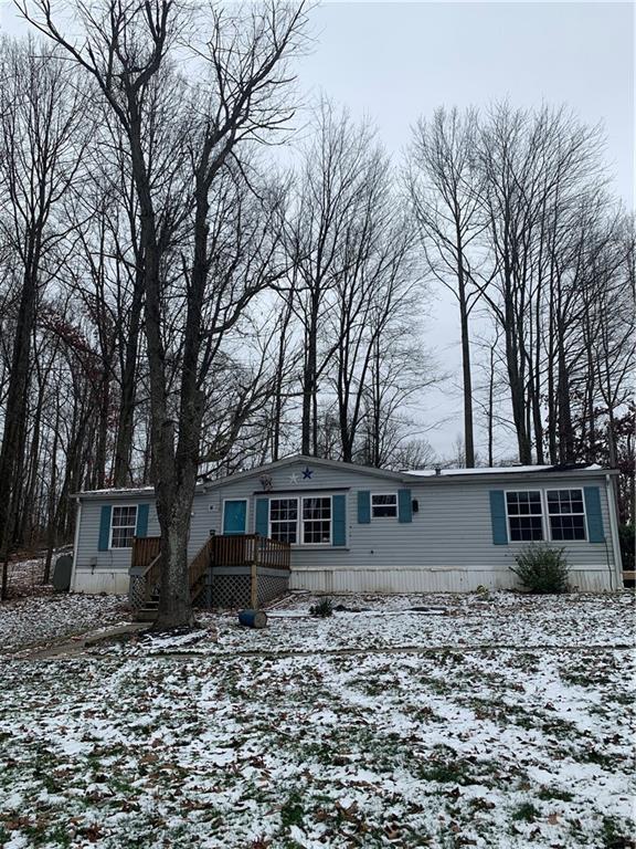 front view of a house with a trees