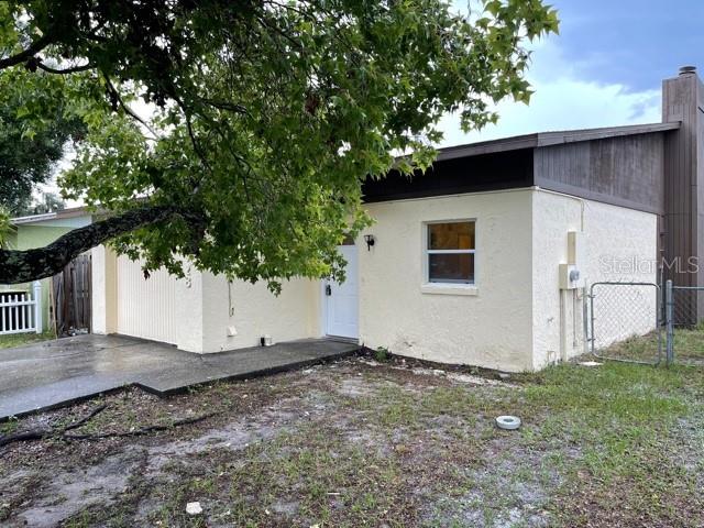 a house with trees in the background