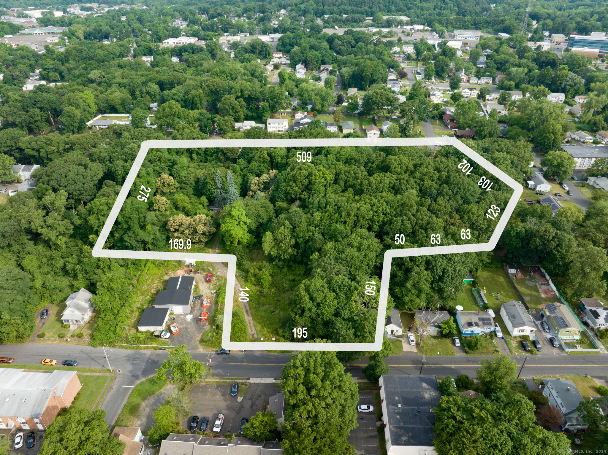 an aerial view of houses with yard