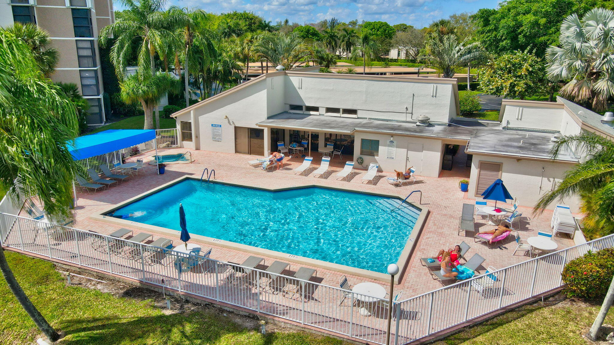 an aerial view of a house with a garden and swimming pool