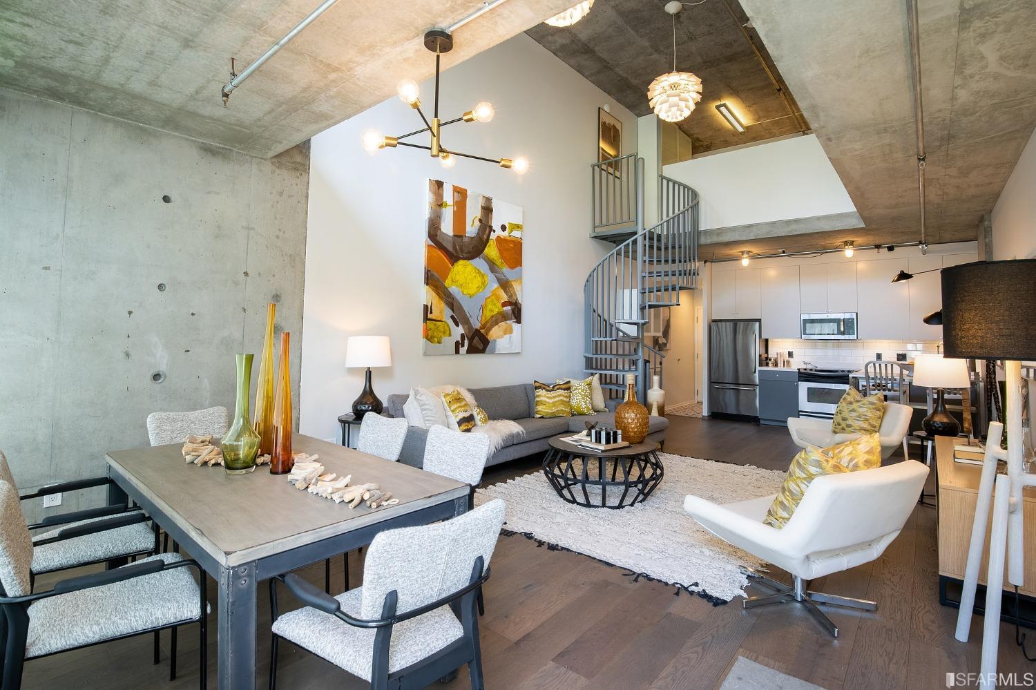 a living room with fireplace furniture and a chandelier