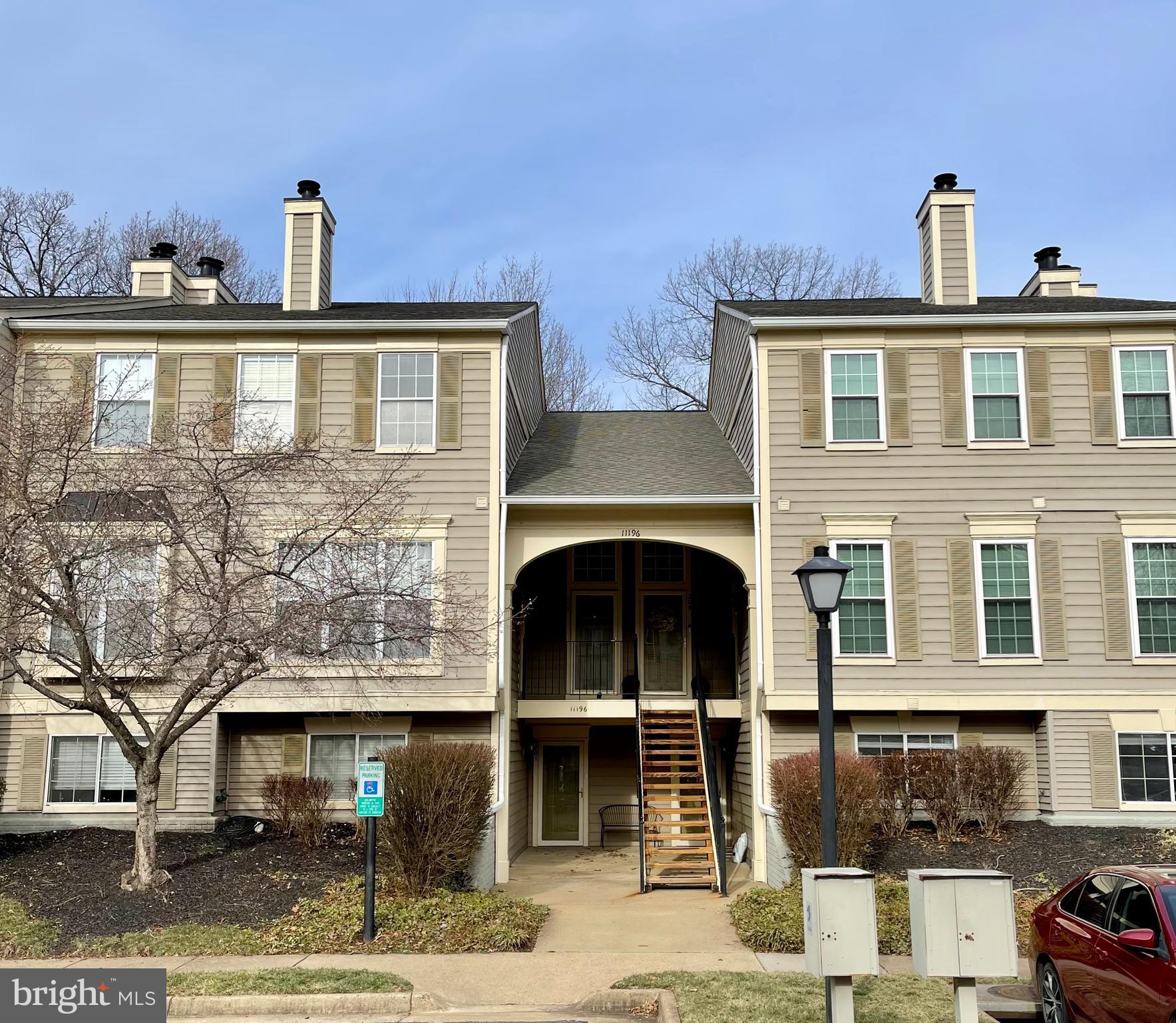 a front view of a house with parking