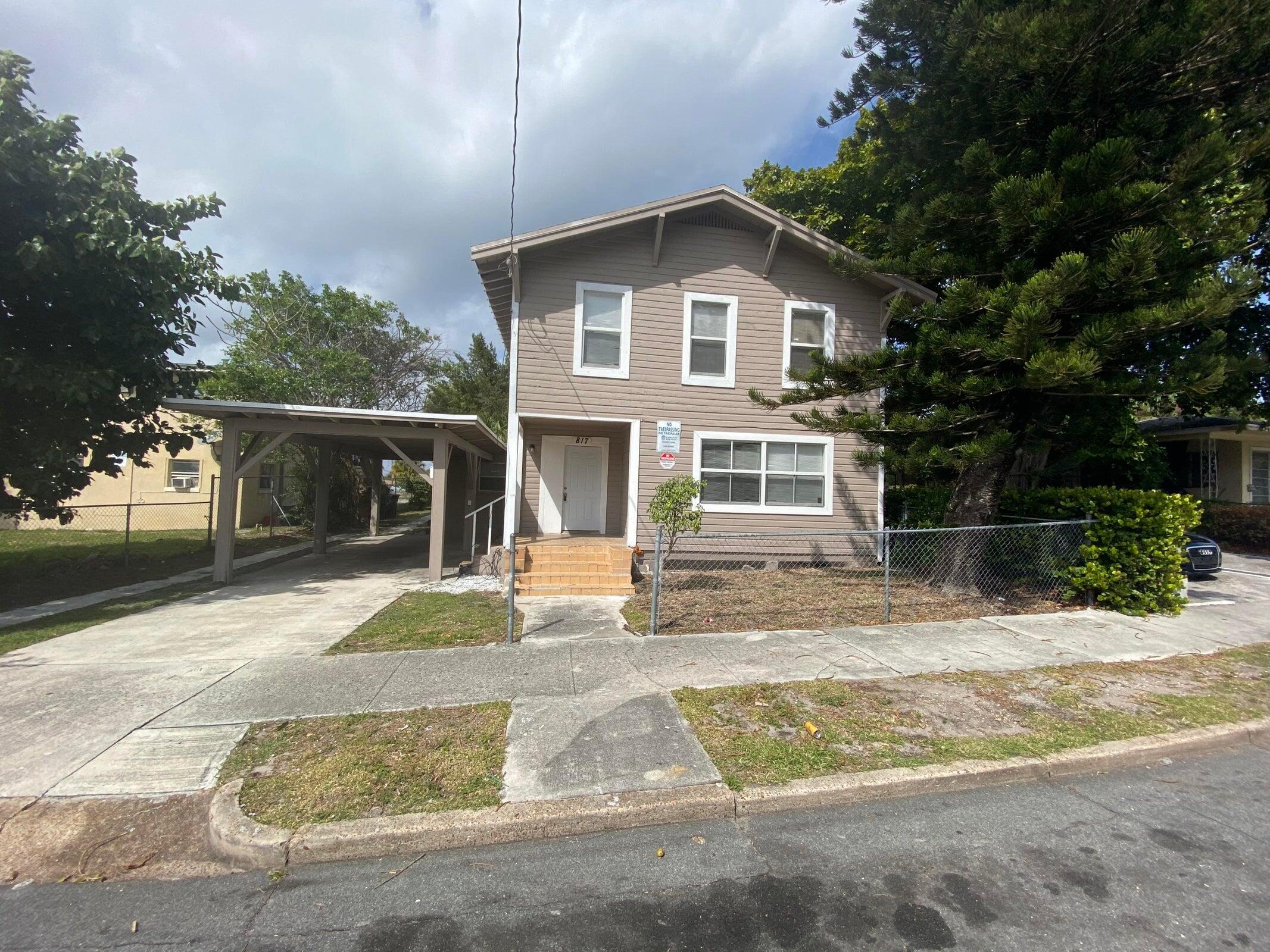 a view of a house with a yard and plants