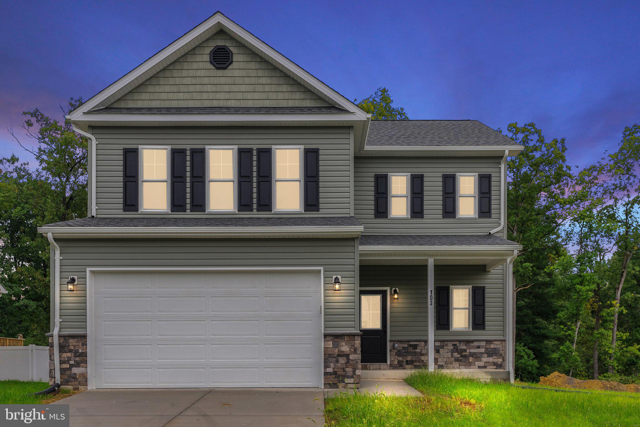 front view of a house with a yard