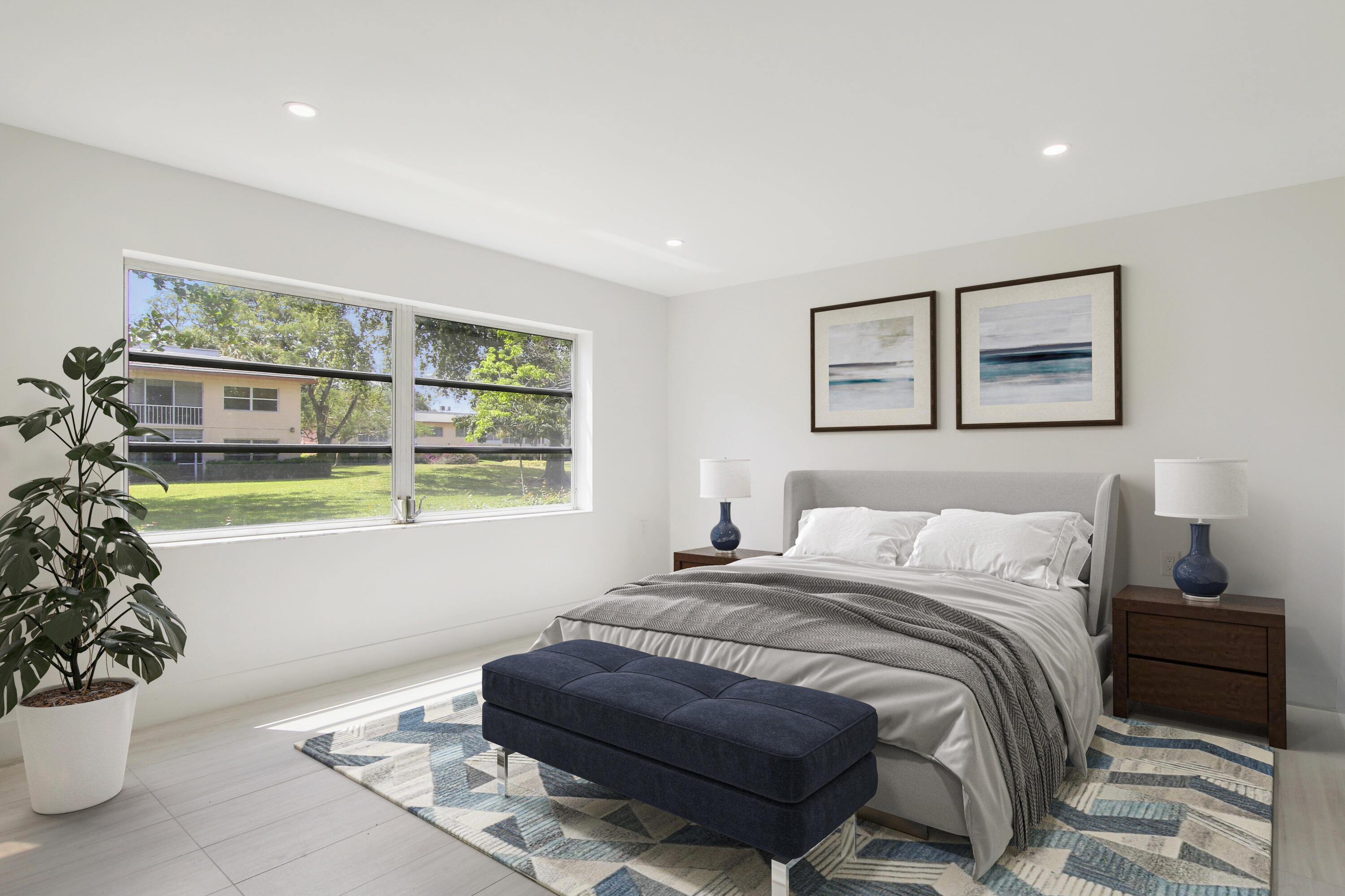 a bedroom with a bed and a potted plant