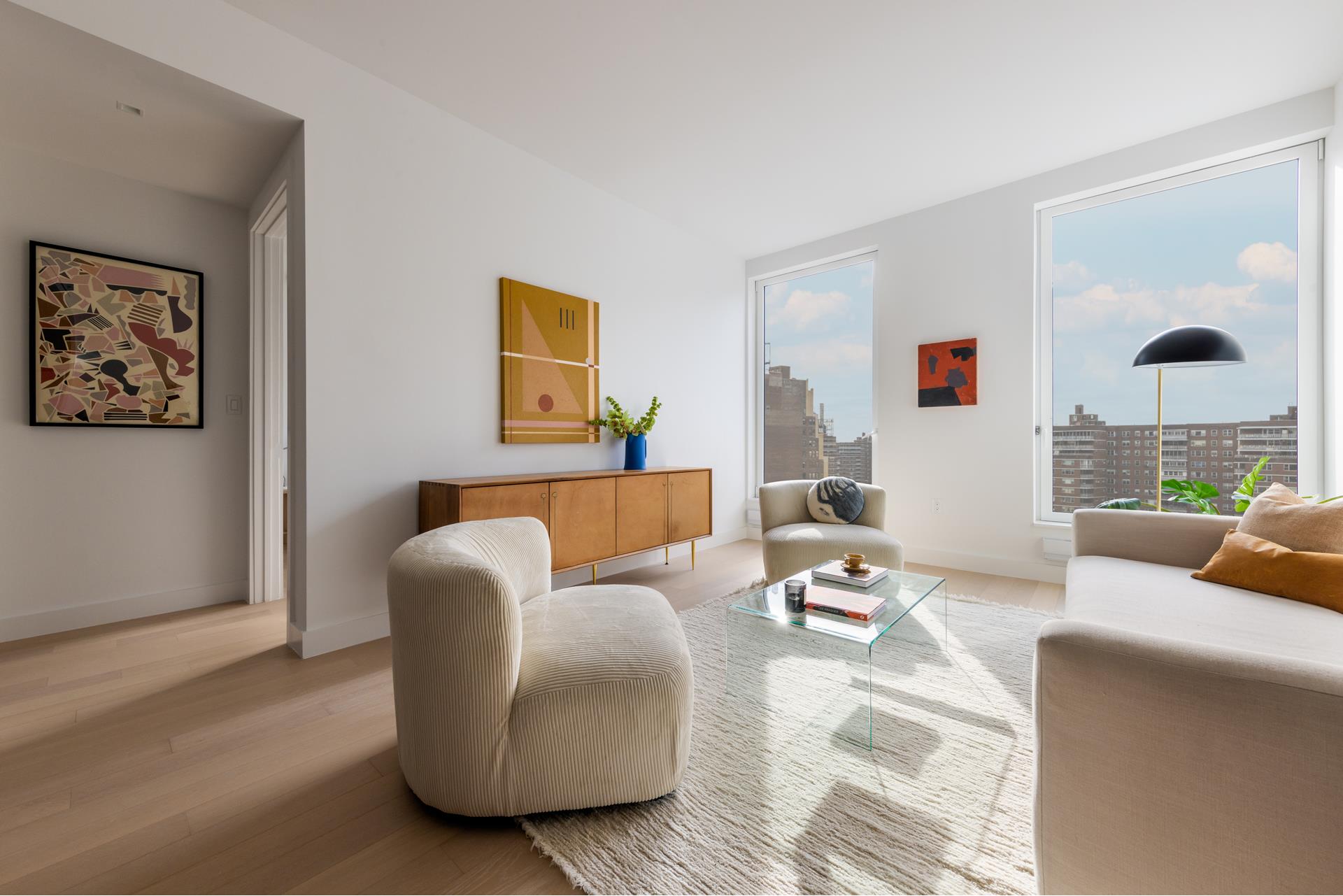 a living room with furniture and a painting