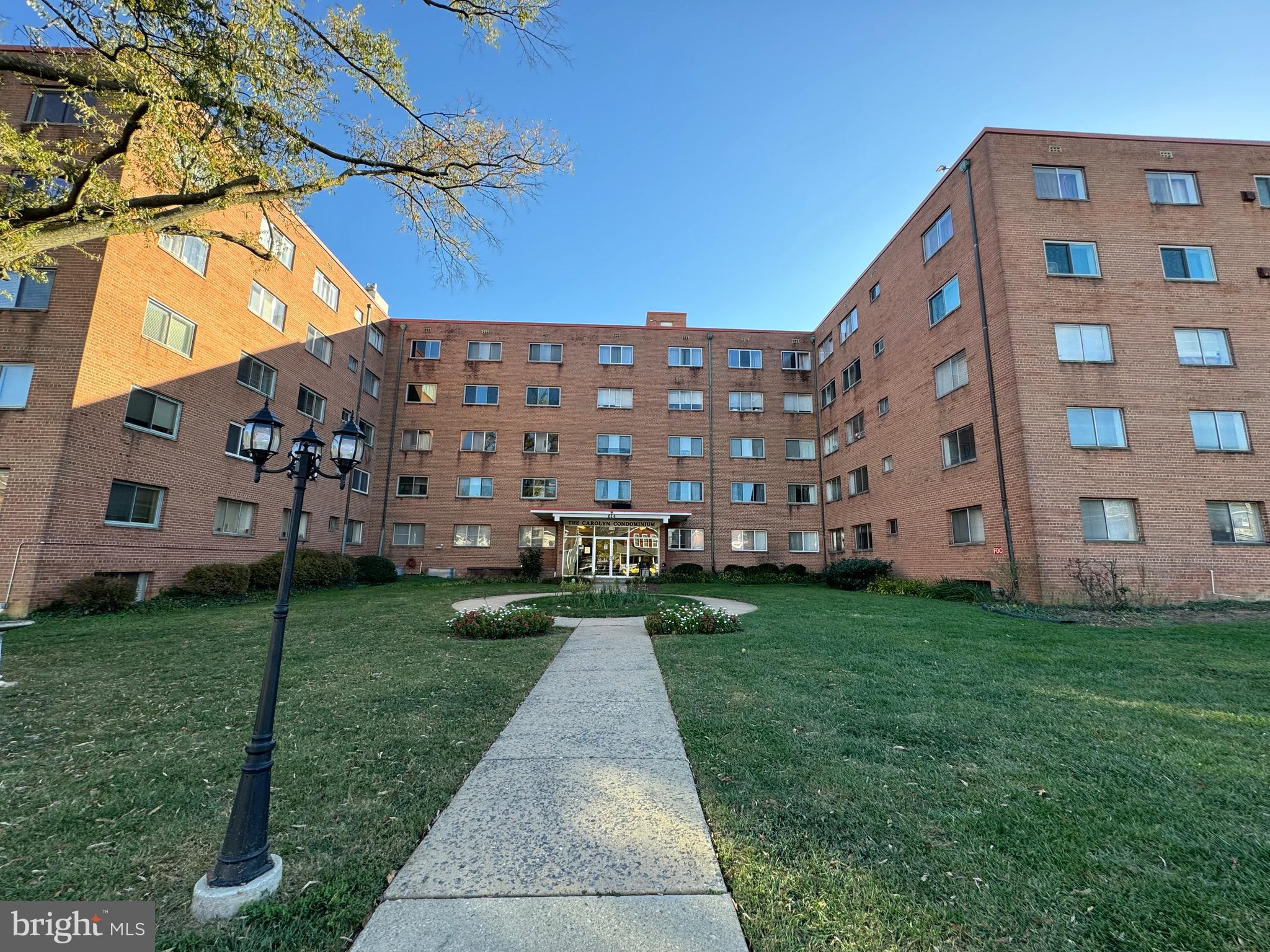 a view of a building with a yard