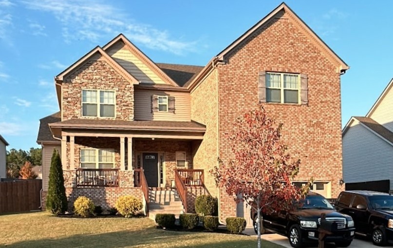 a view of a car park in front of a house