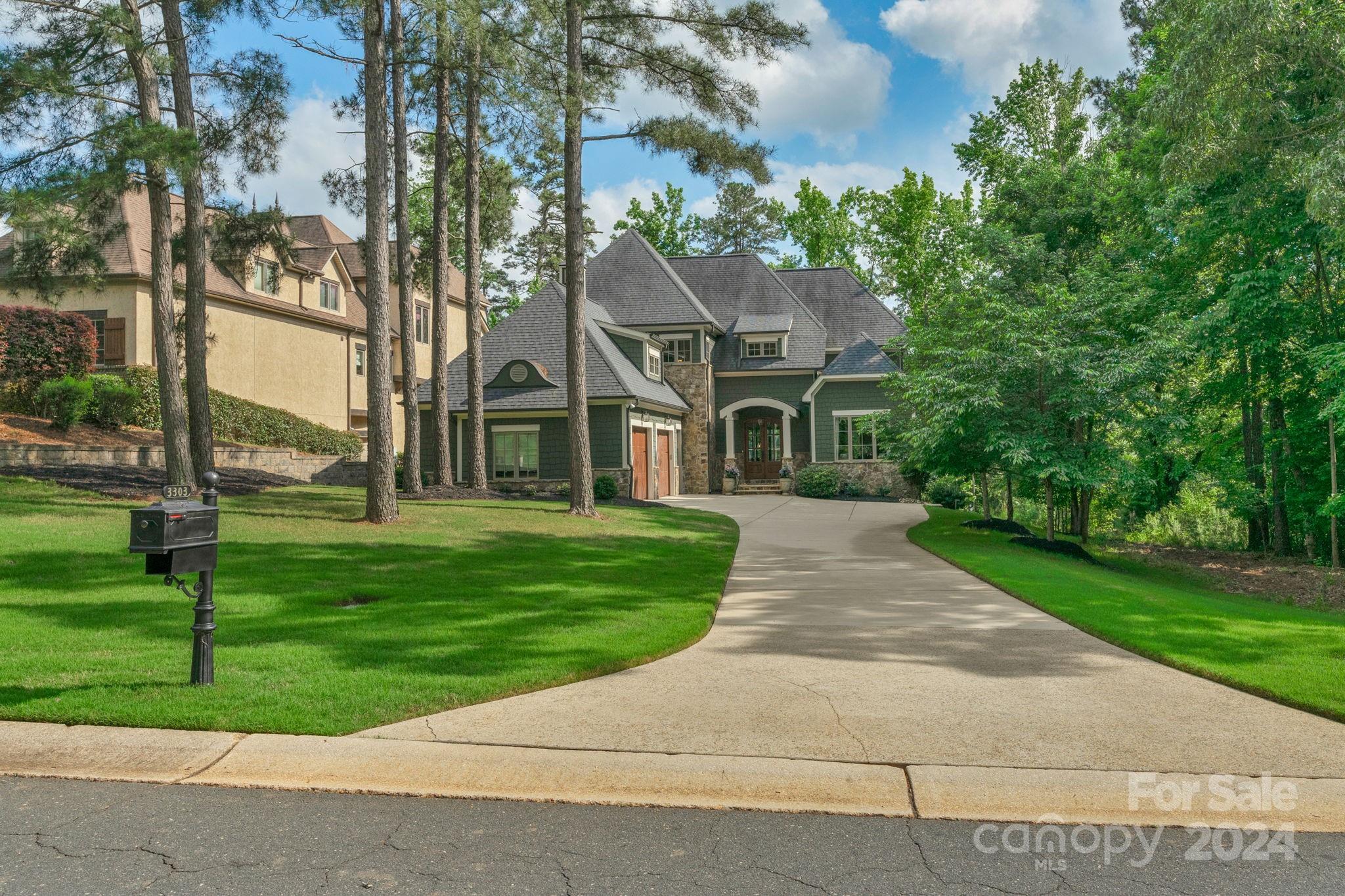 a front view of house with yard and green space