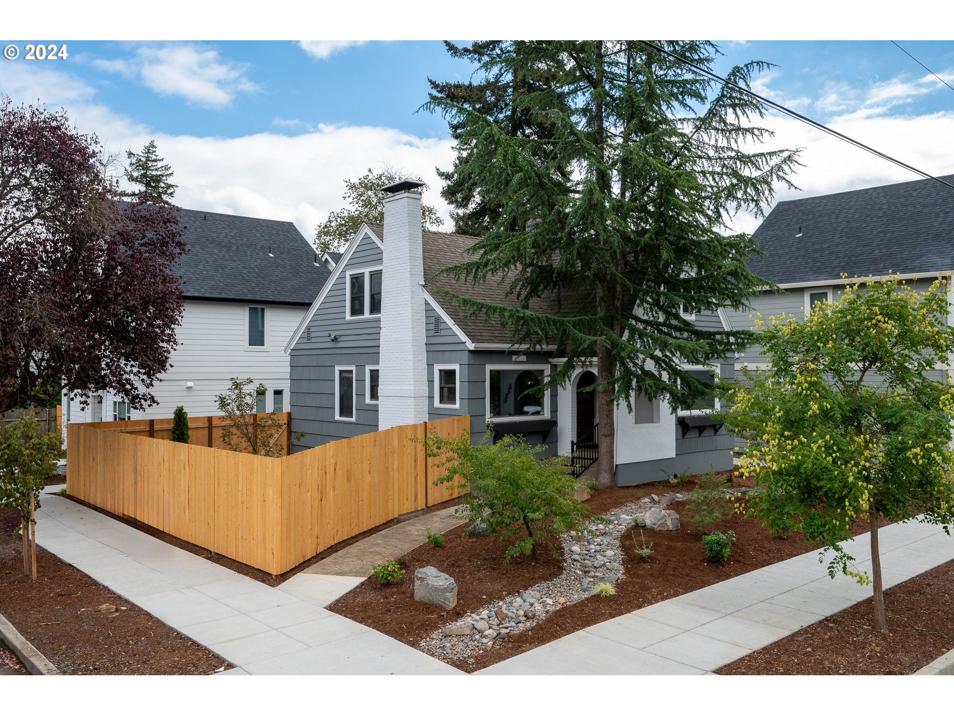 front view of a house with a yard