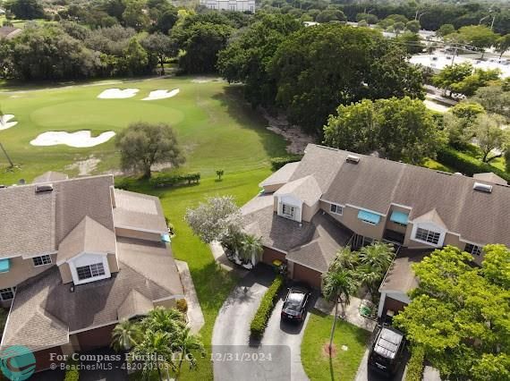 an aerial view of a house with a garden