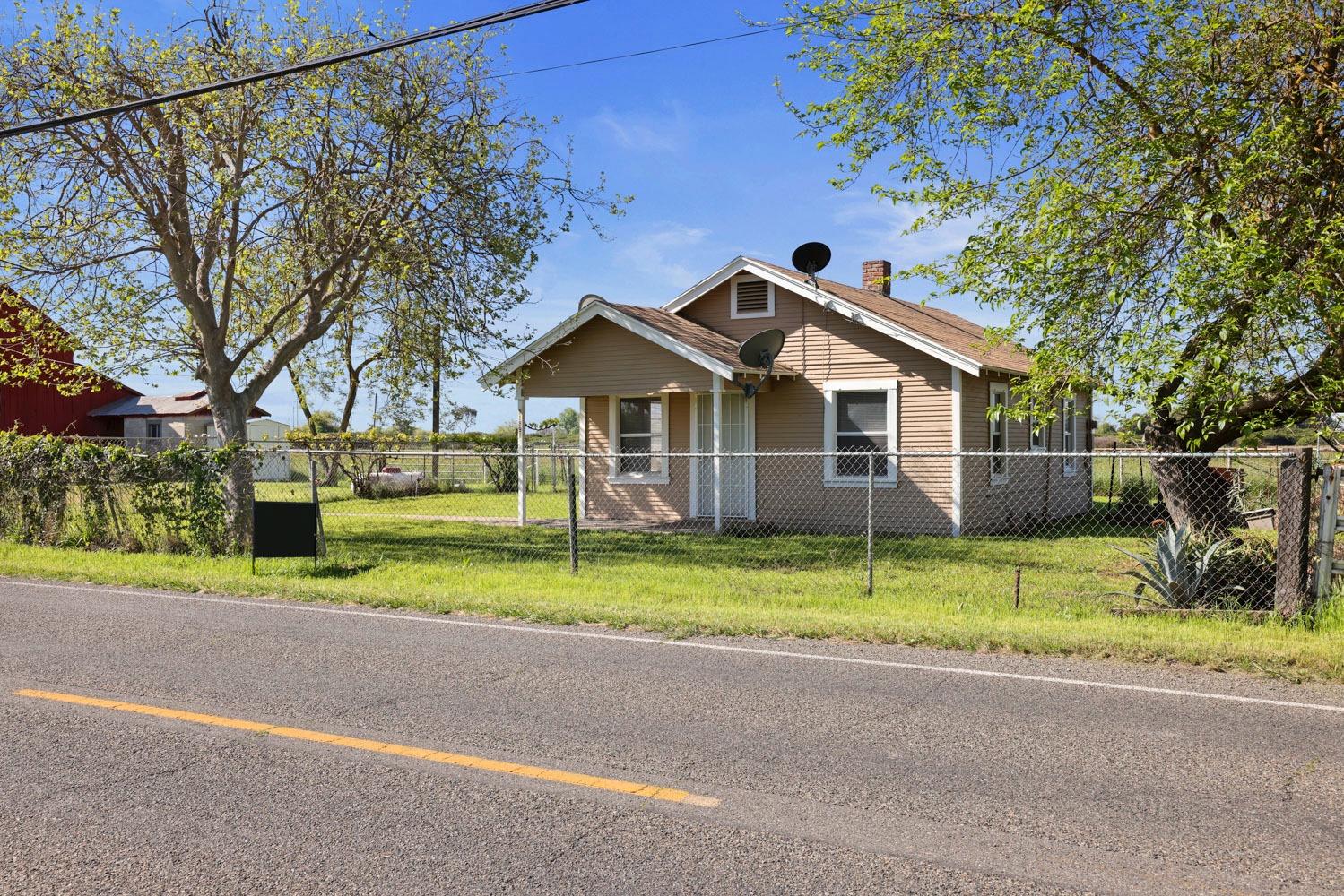 a front view of a house with a yard and porch