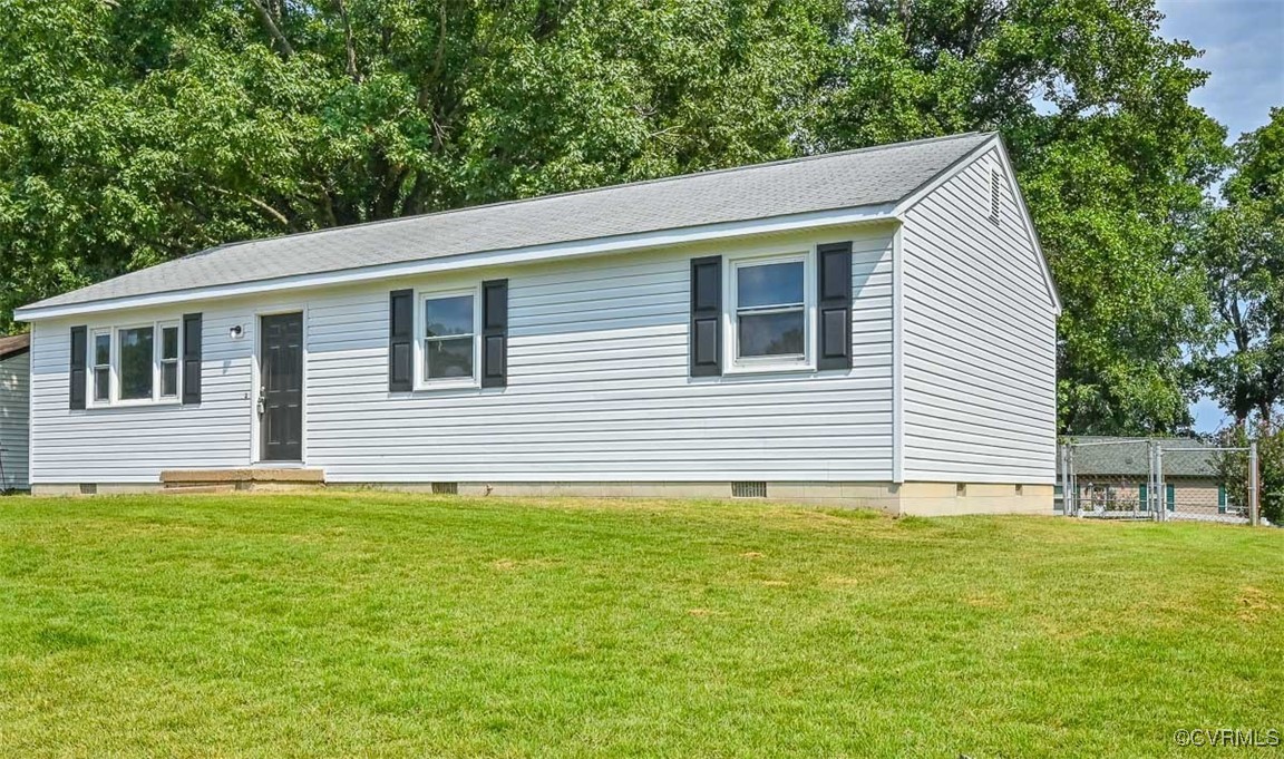 a house that has a big yard in front of it