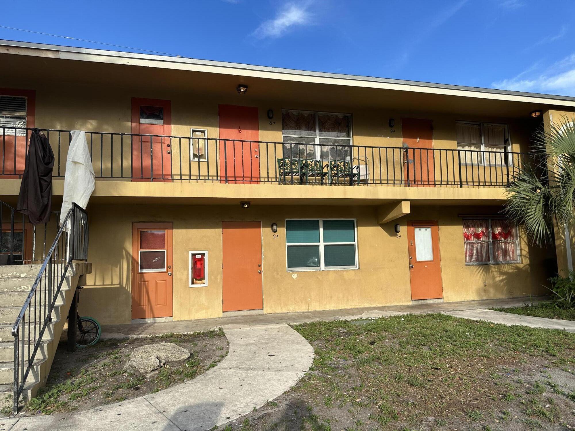 a front view of a house with parking area