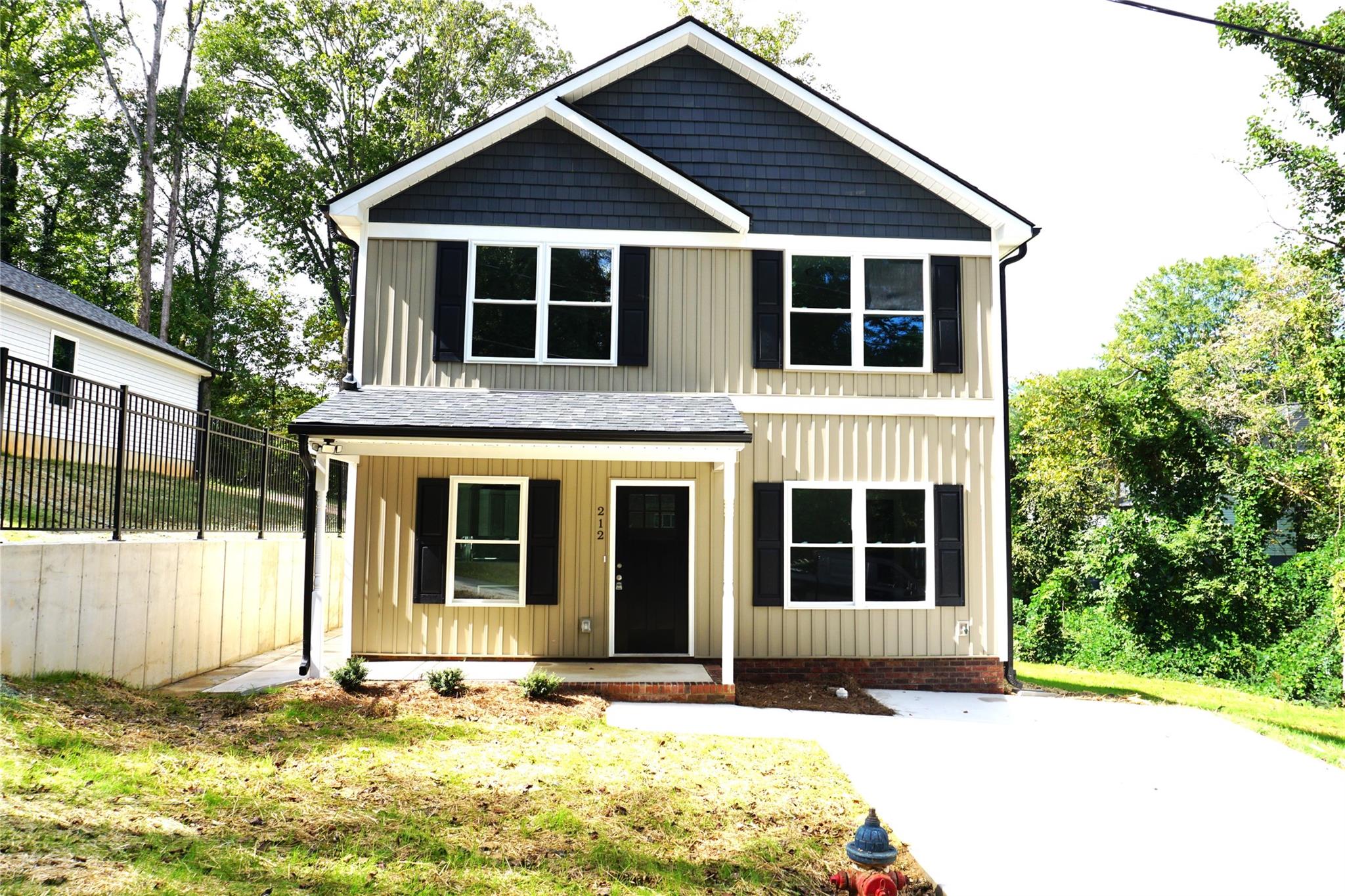 a view of front of house with a yard