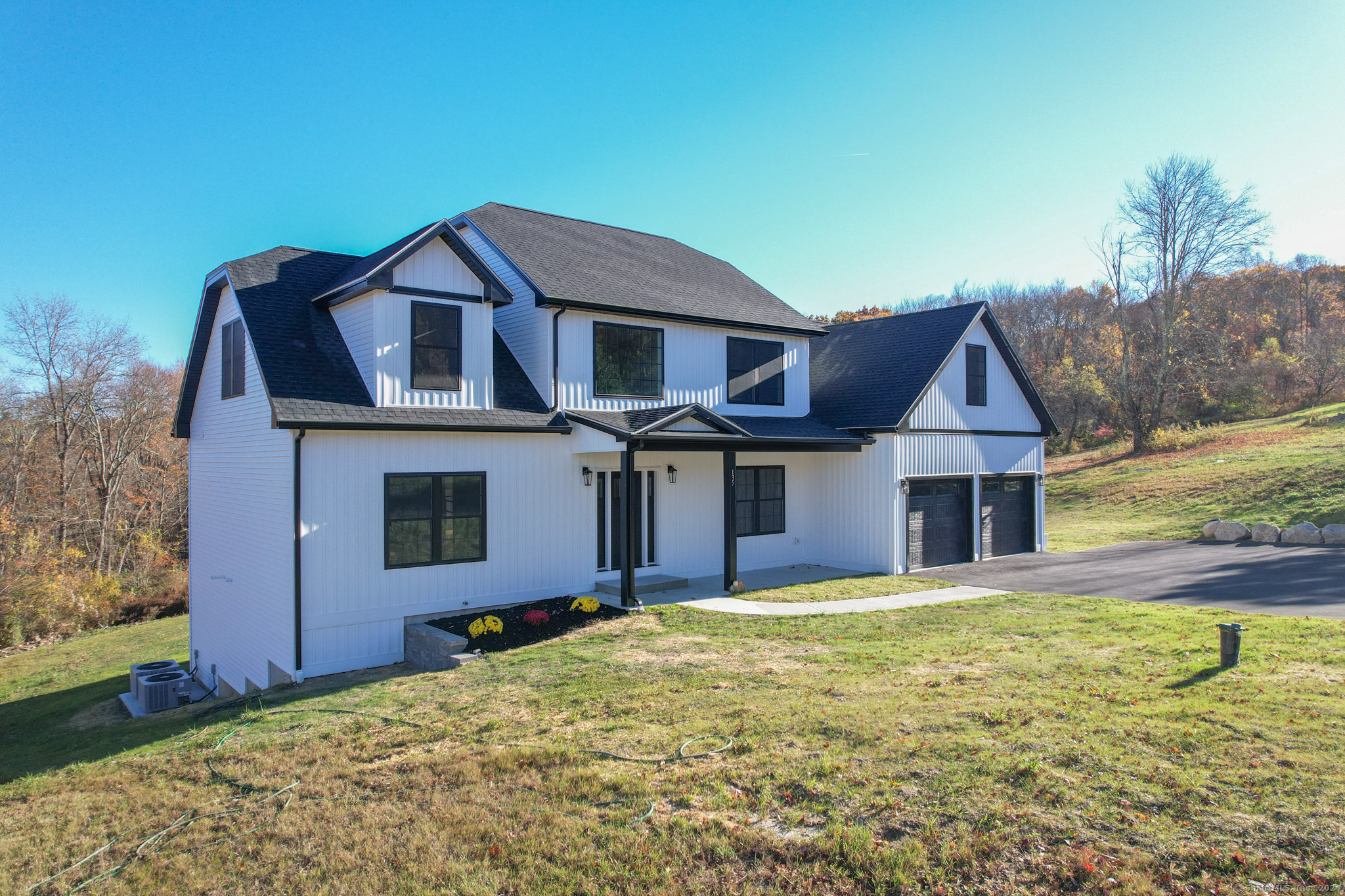 a front view of a house with a yard