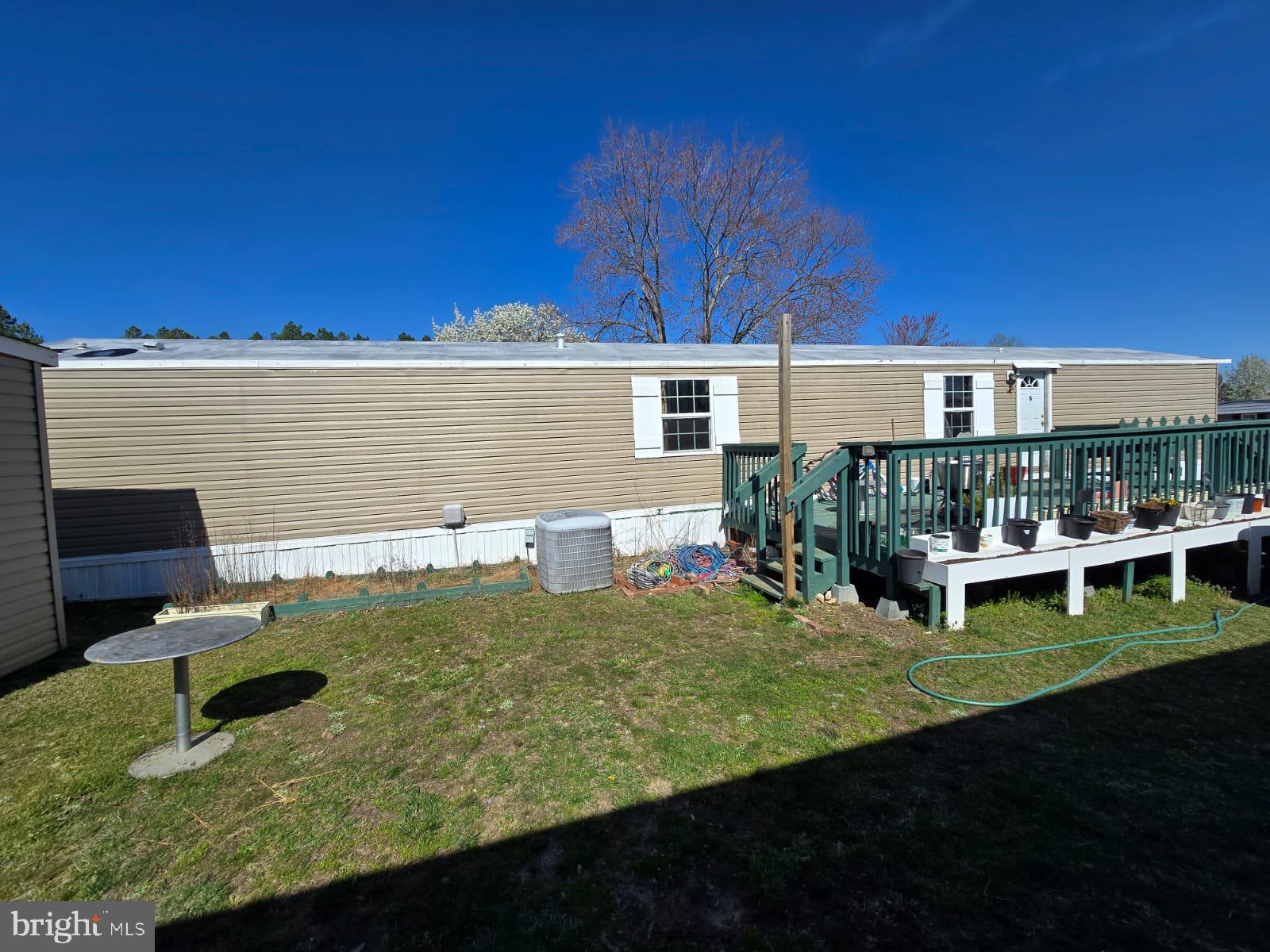 a view of a house with backyard porch and sitting area