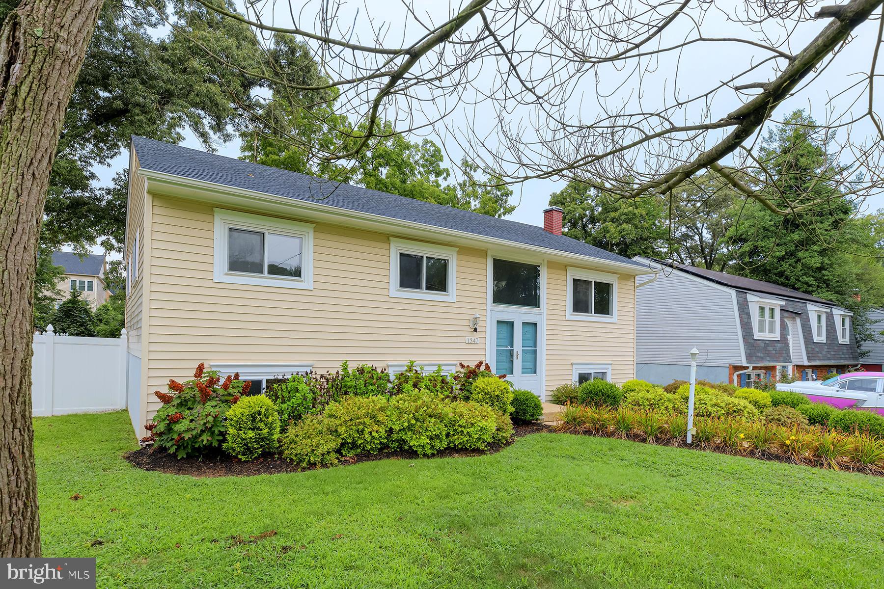 a view of a house with a backyard