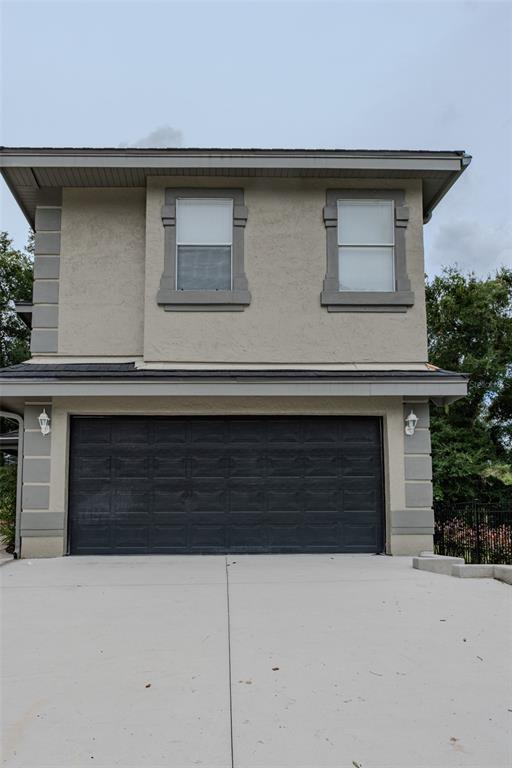 a front view of a house with garage