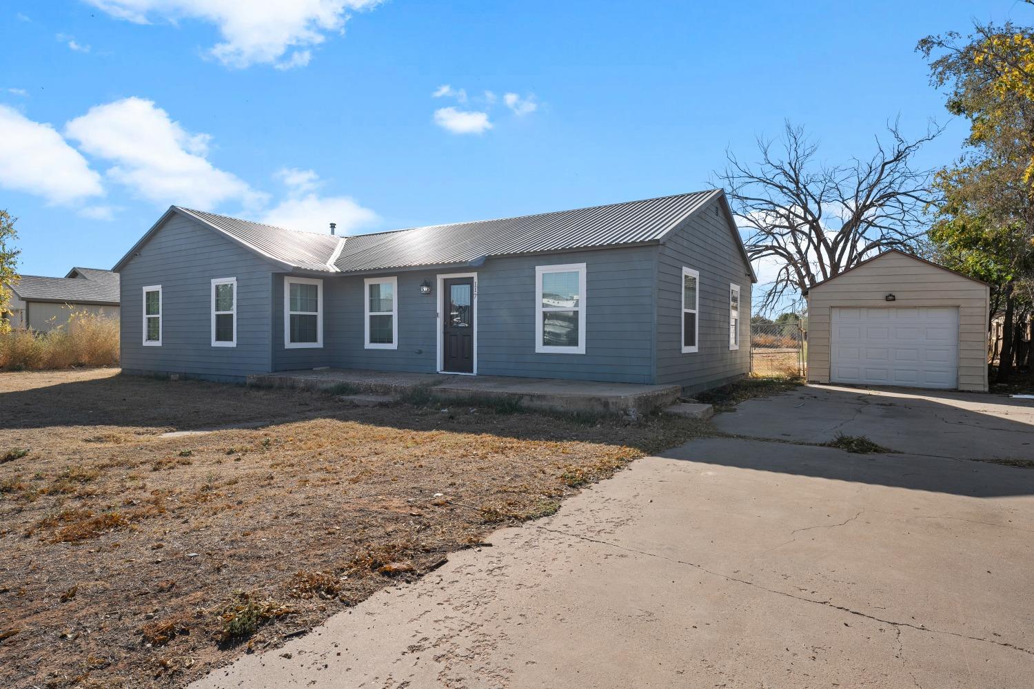 front view of a house with a yard