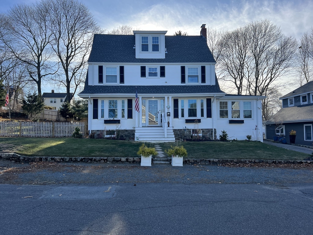 front view of a house with a street