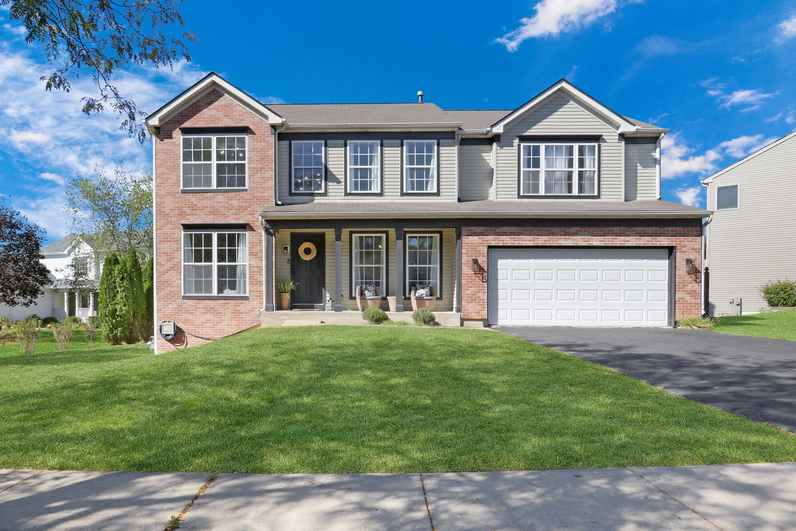 front view of a house with a yard