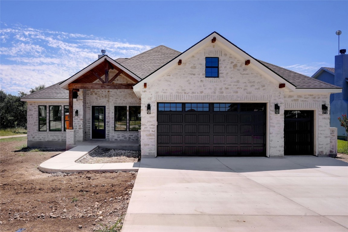 a front view of a house with a garage