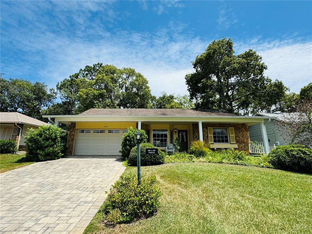 a front view of house with yard and green space