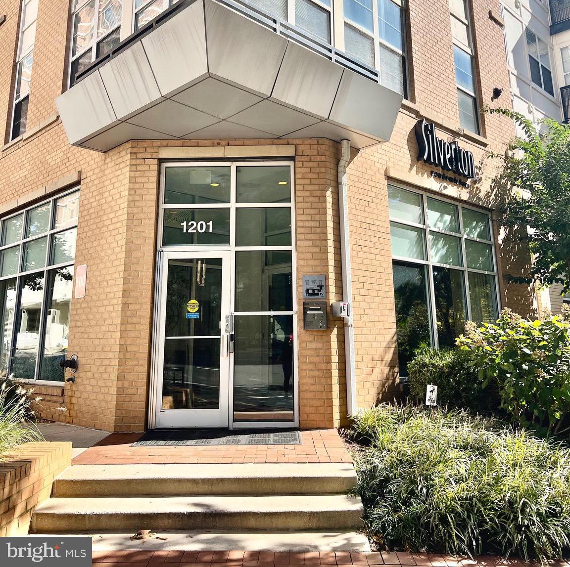 a view of a building with glass windows and door