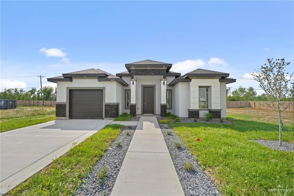 a front view of a house with yard