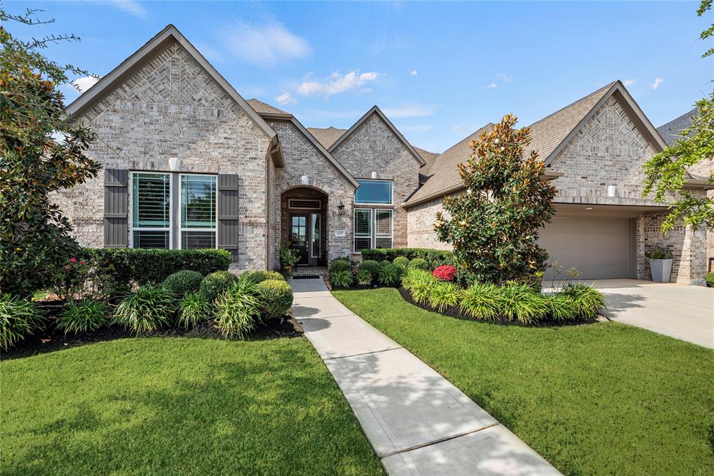 Welcome home to this beautifully situated property on a generous 75-ft lot, offering plenty of space and stunning landscaping that greets you from the moment you arrive.