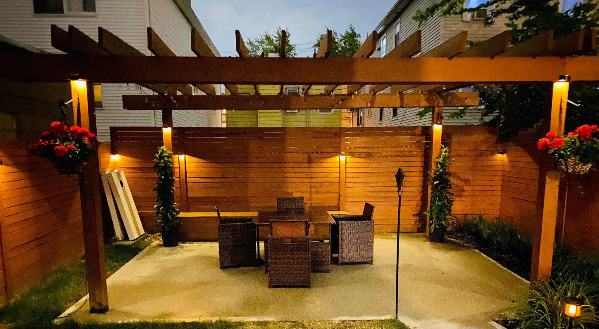 a dining room with furniture and a potted plant