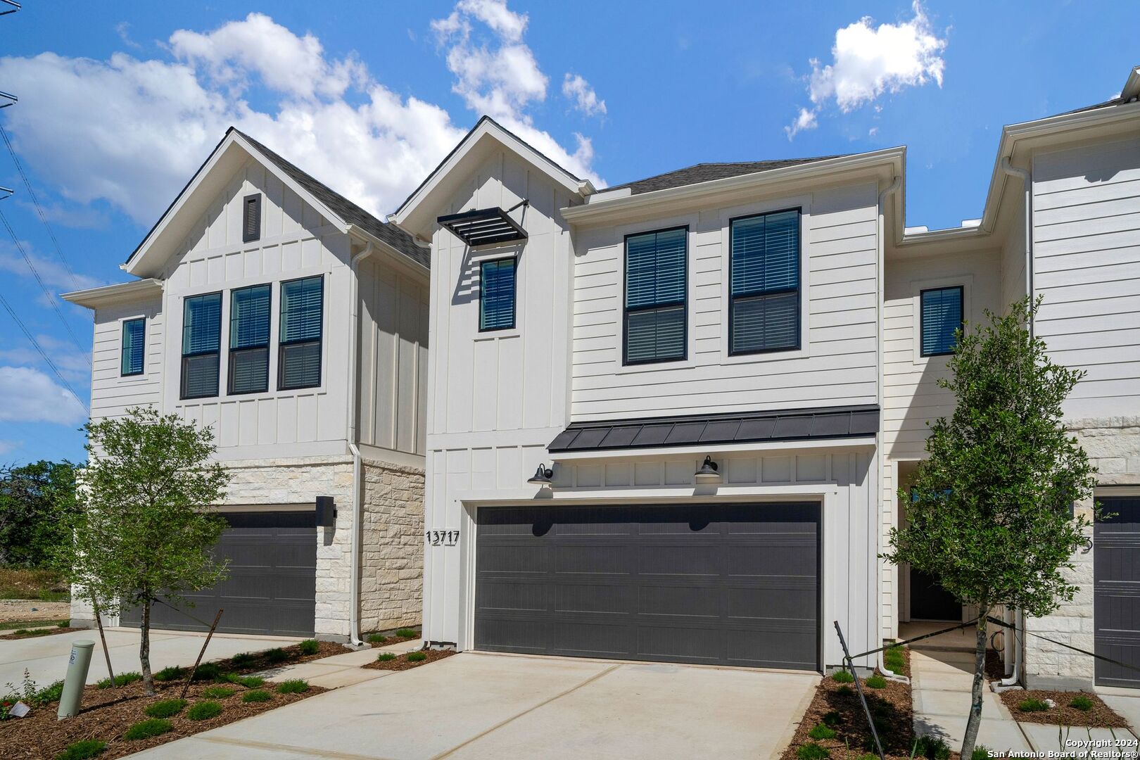 a front view of a house with a garage