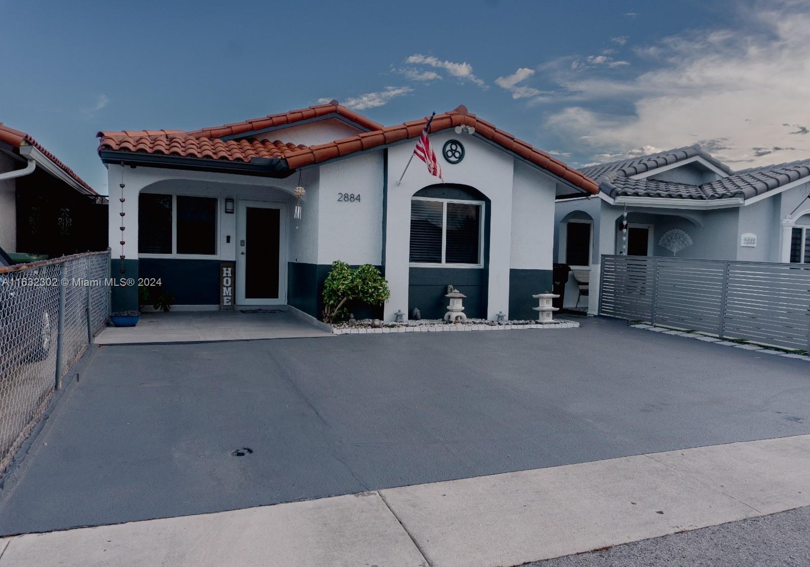 front view of a house with a street