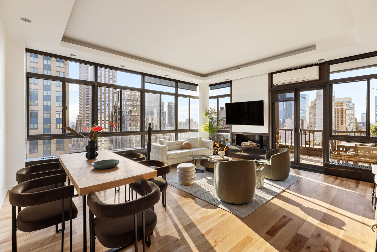 a view of a living room and dining room with furniture