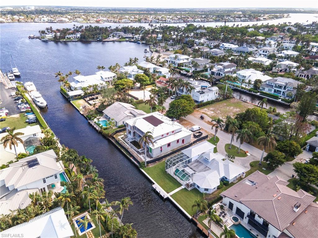 an aerial view of a city with lake