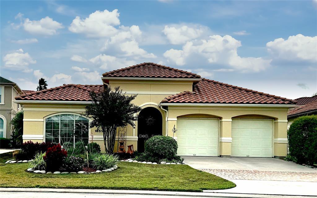 front view of a house with a garden