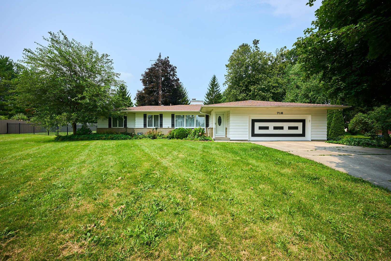 a house view with a garden space