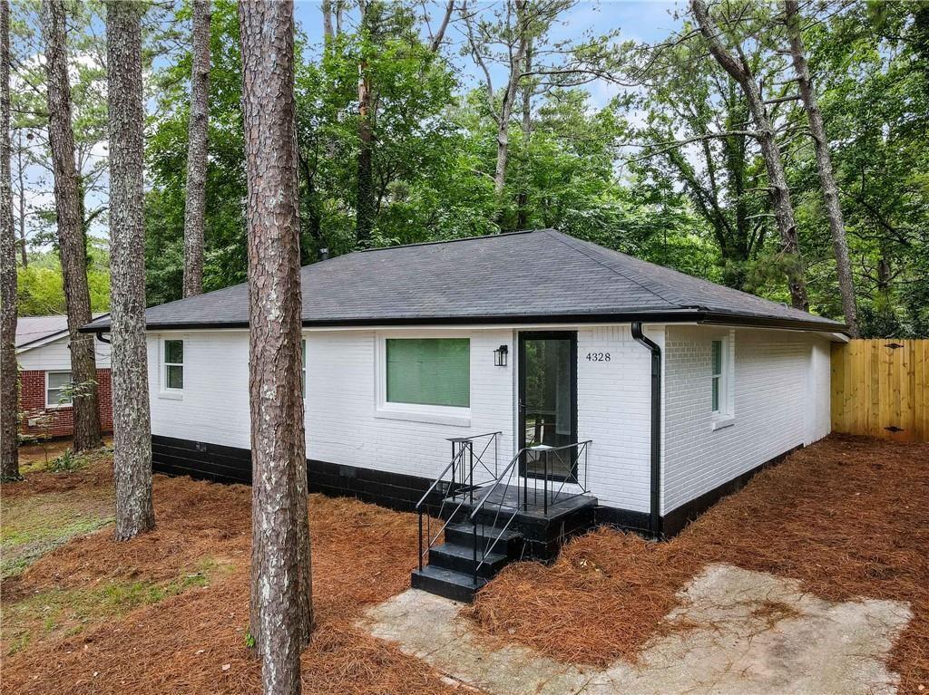 a house with trees in the background