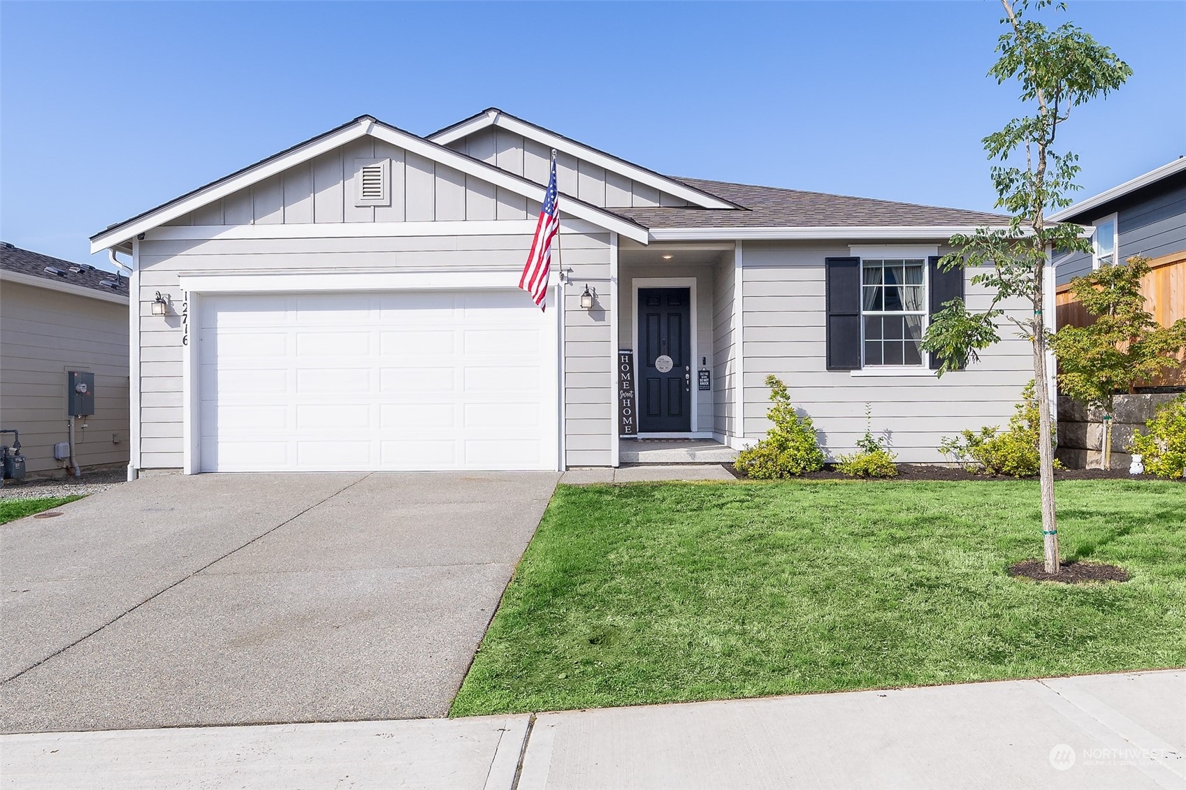 a front view of a house with a yard