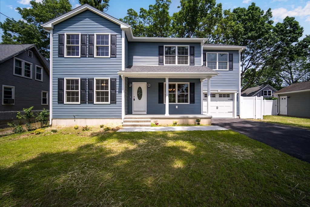 a front view of a house with a yard