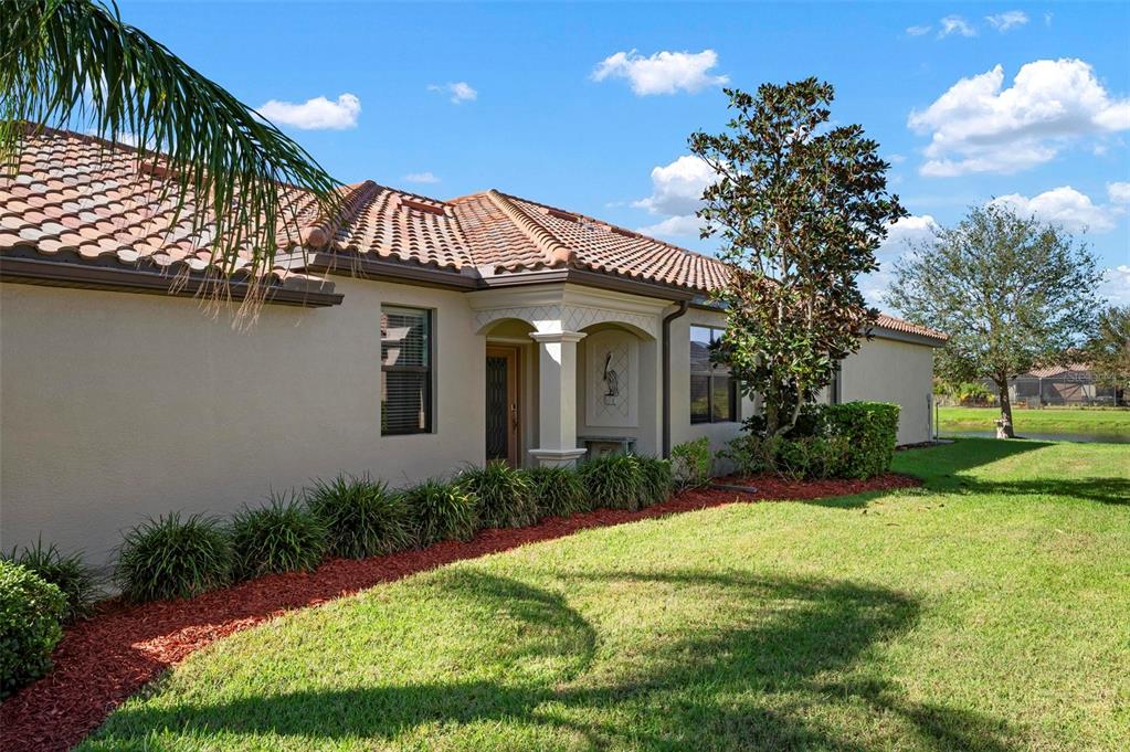 a front view of a house with garden