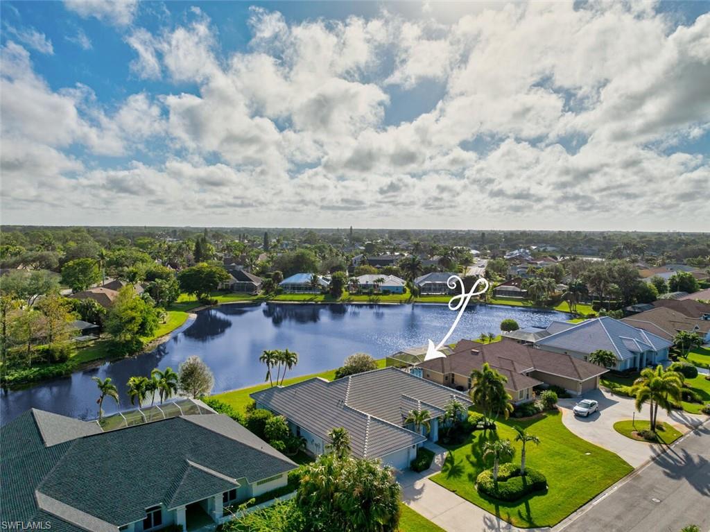 an aerial view of house swimming pool and lake view