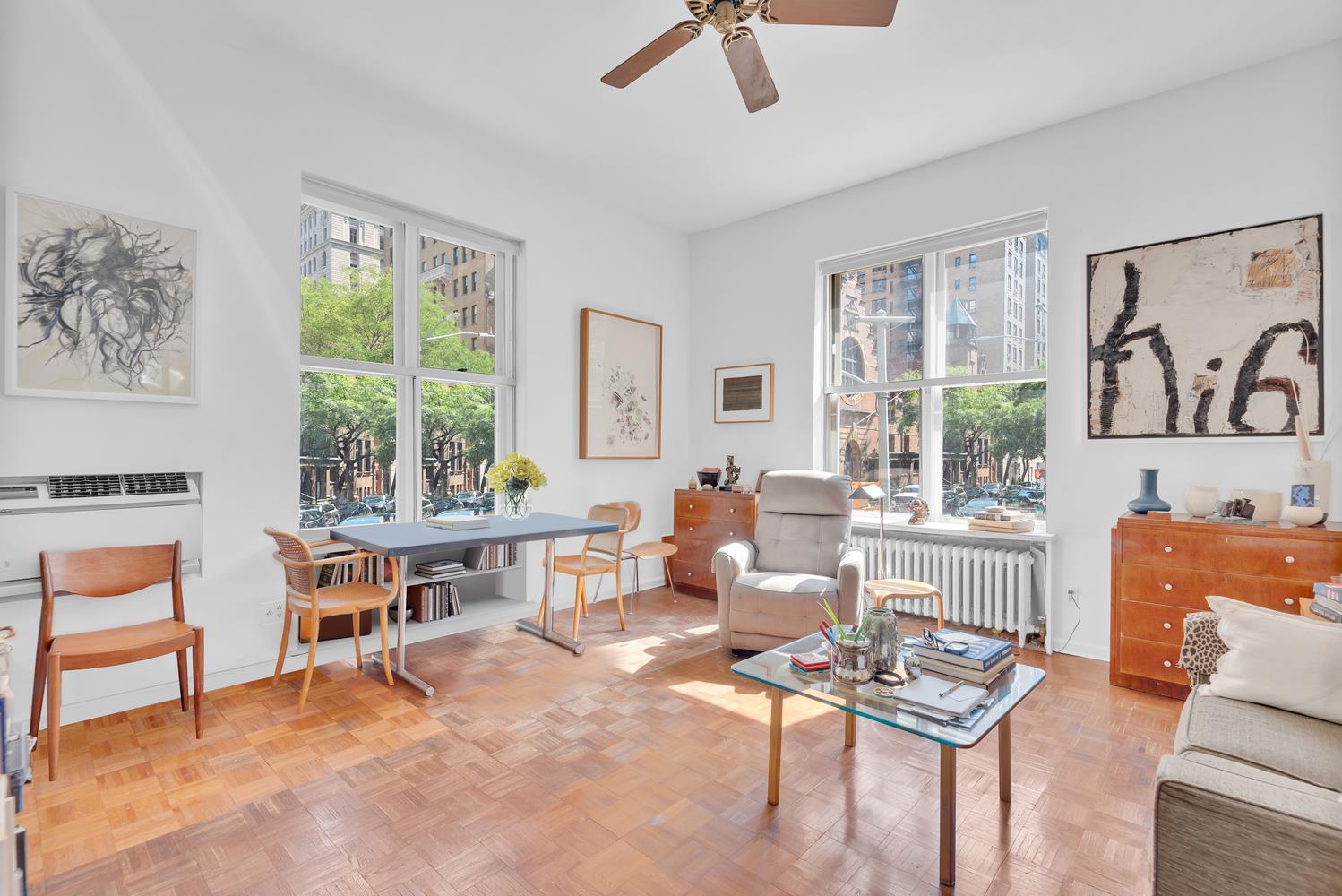 a living room with furniture a window and a table