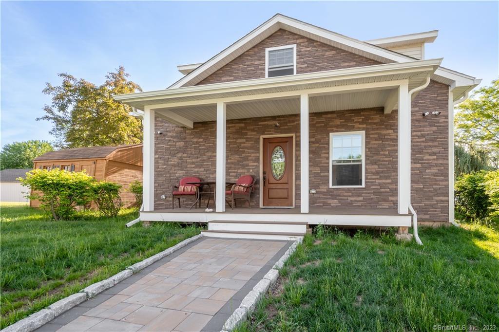 front view of a house with a yard