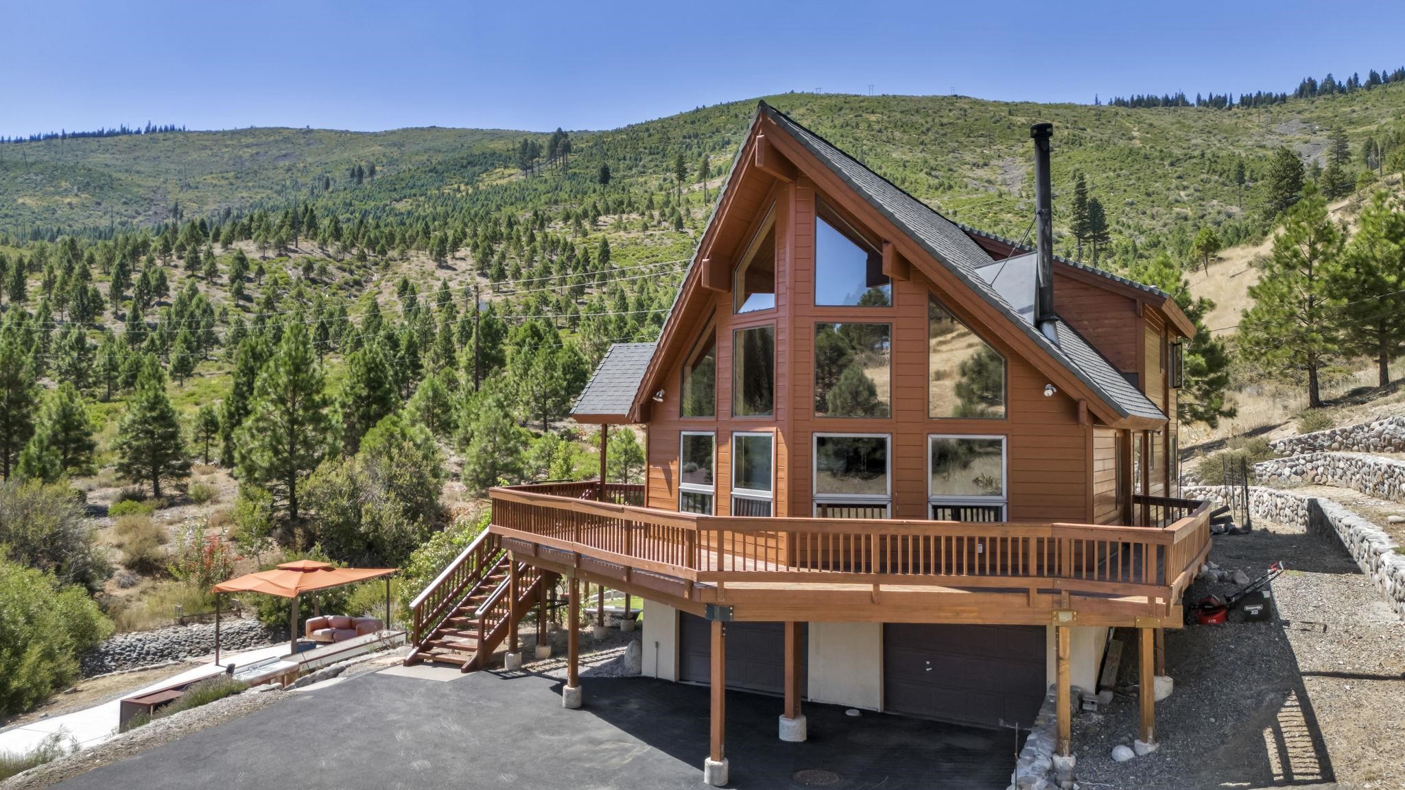 a view of house with outdoor seating and city view